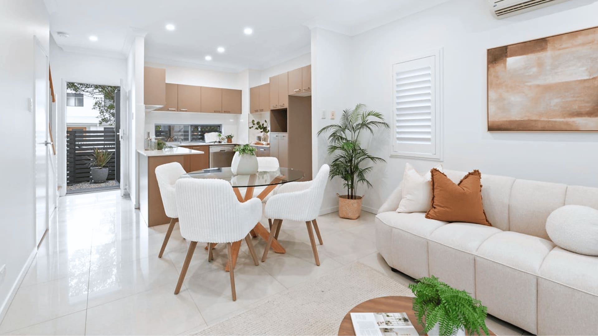 Bright furnished living and dining area in a contemporary investment property